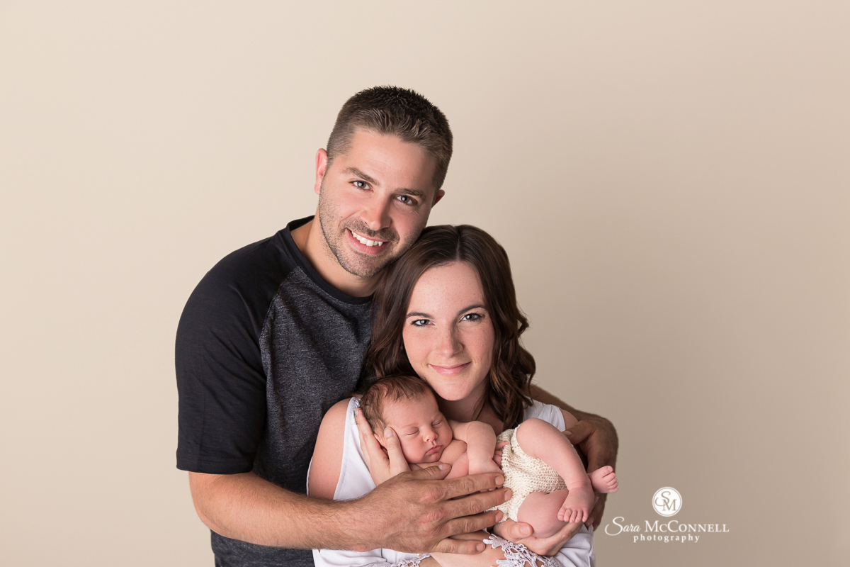 Ottawa newborn photographer Mother and father holding baby