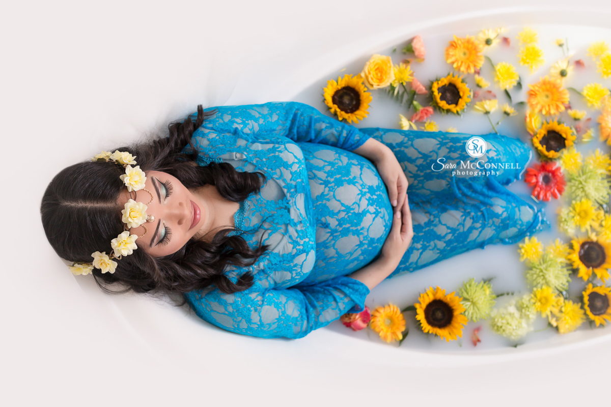Milk Bath Photos by Sara McConnell Photography - Expectant Mother in bath of milk with flowers