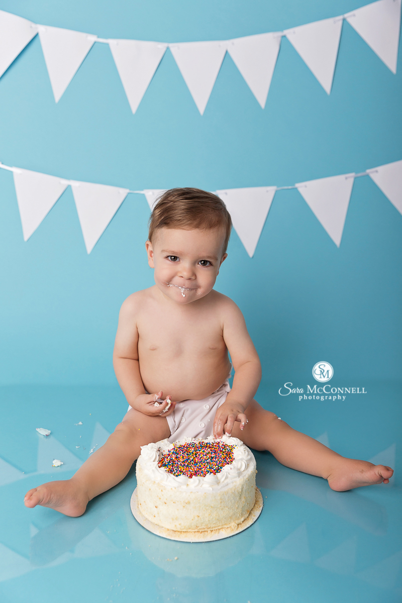 Baby eating cake to celebrate his birthday