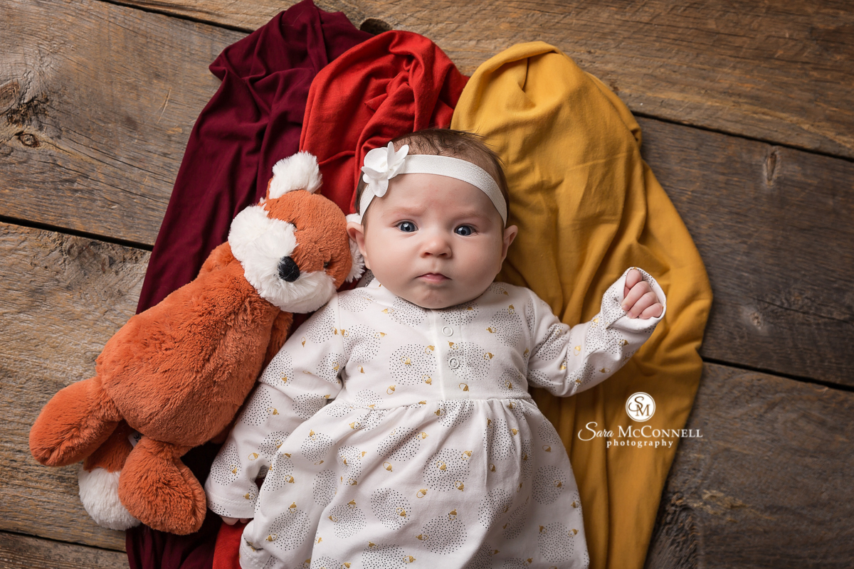 Baby photos with an Autumn colour scheme and set design