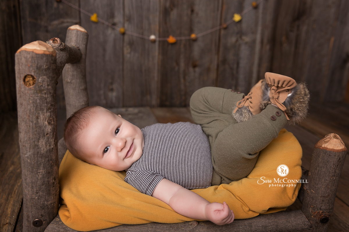 Baby photos with an Autumn colour scheme and set design