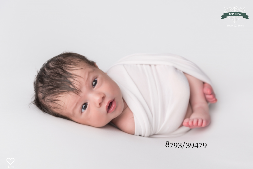 newborn baby with eyes wide open