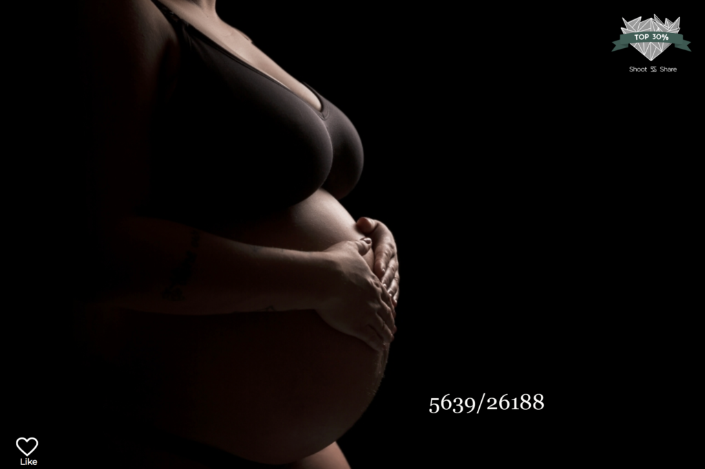 silhouette of a pregnant women's belly