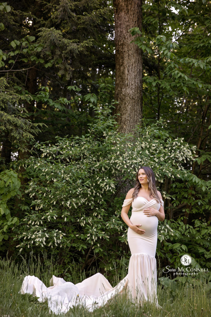 pregnant woman in a white gown