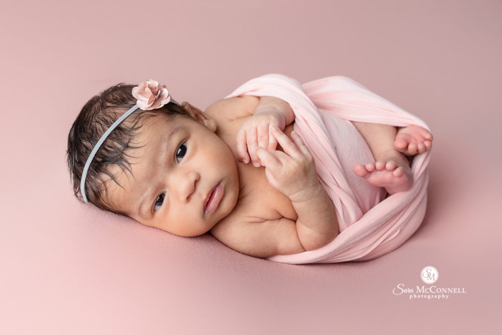 A photo of a newborn baby in a blog post about styling a newborn session. Newborn photographers ottawa.