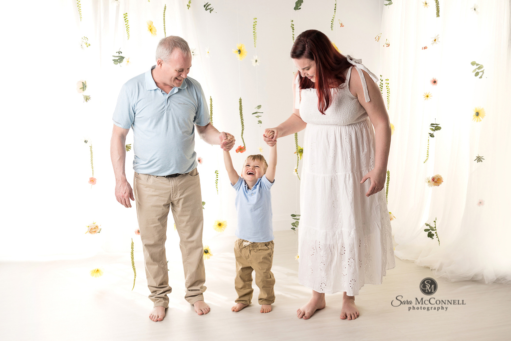 Photo of a family of 3 in a blog post about 3 reasons to book yearly photo sessions. Ottawa maternity photographer
